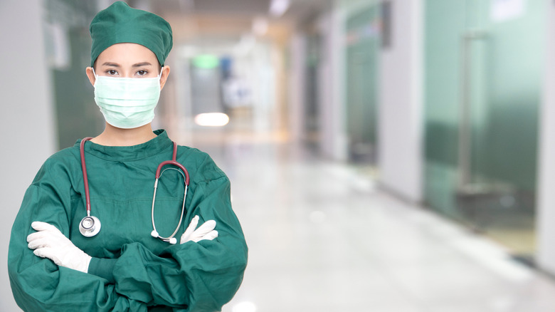 Nurse standing in hospital hallway