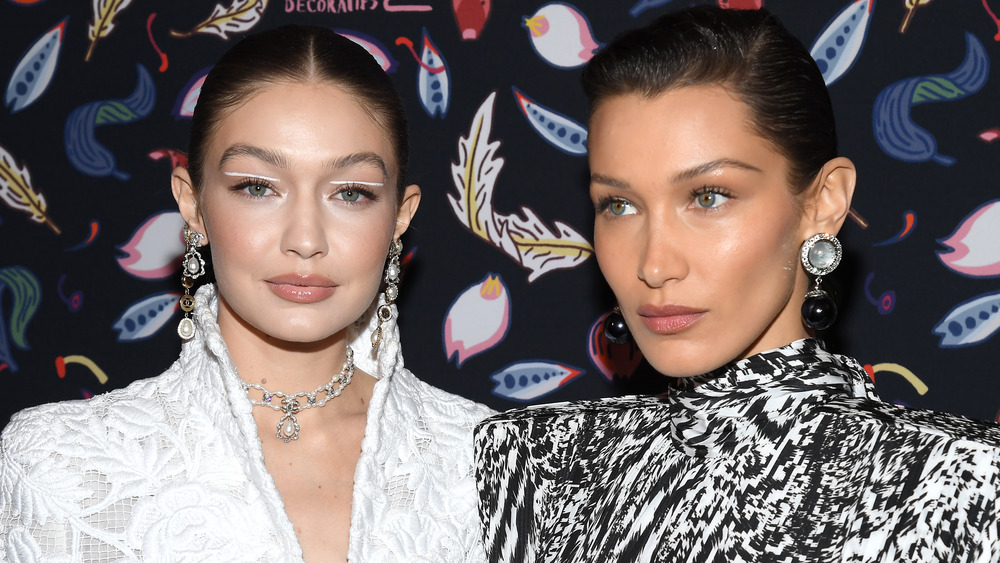 Gigi Hadid and Bella Hadid attend the Harper's Bazaar Exhibition as part of the Paris Fashion Week Womenswear Fall/Winter 2020/2021 At Musee Des Arts Decoratifs on February 26, 2020 in Paris, France. 