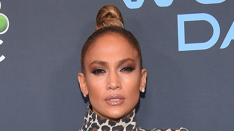 Jennifer Lopez posing  with high bun