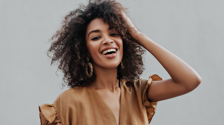 woman with curly hair posing