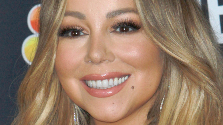 Mariah Carey smiling at event
