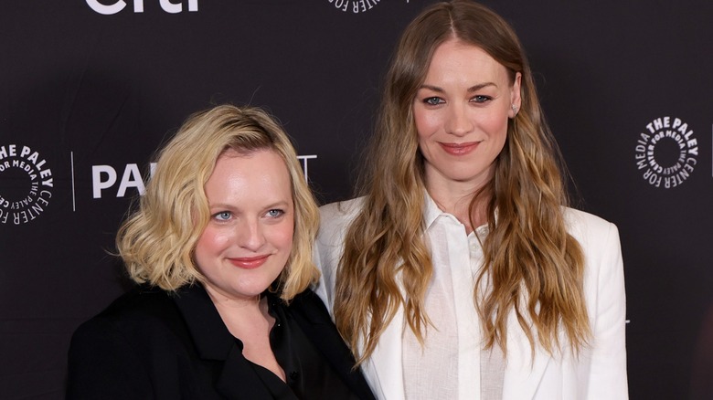 Elisabeth Moss in black and Yvonne Strahovski in white on the red carpet