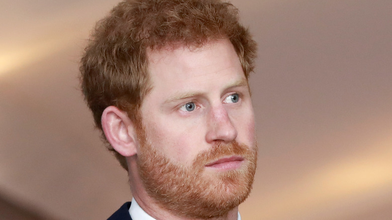 Prince Harry looking serious at event