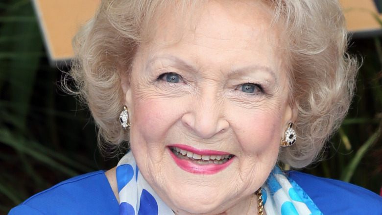Betty White smiling in blue