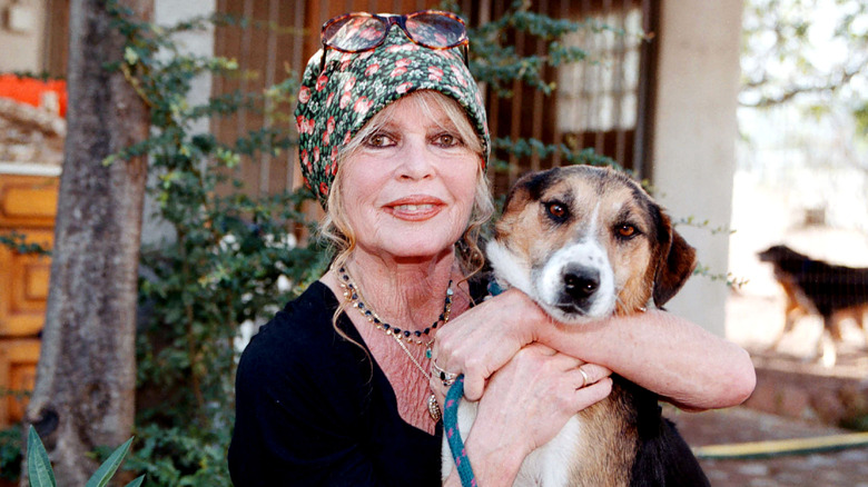 Brigitte Bardot in bandanna with dog