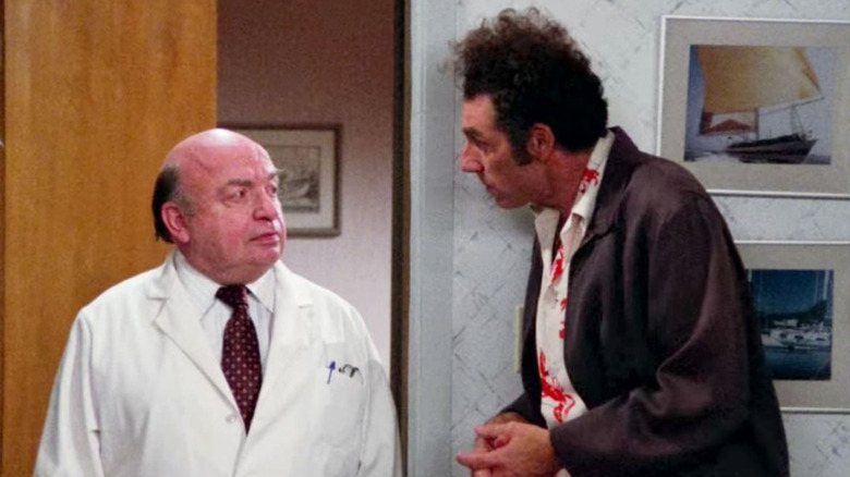 Lou Cutell as Dr. Howard Cooperman and Michael Richards as Kramer on Seinfeld