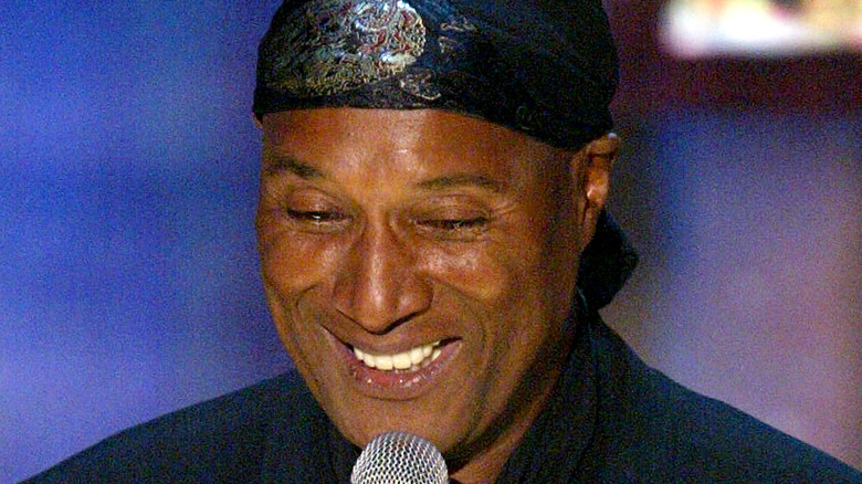 Paul Mooney holding microphone