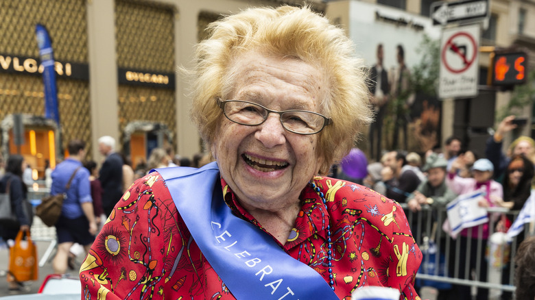 Dr. Ruth smiling at parade