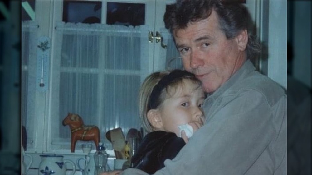 John Reilly hugging daughter in throwback photo