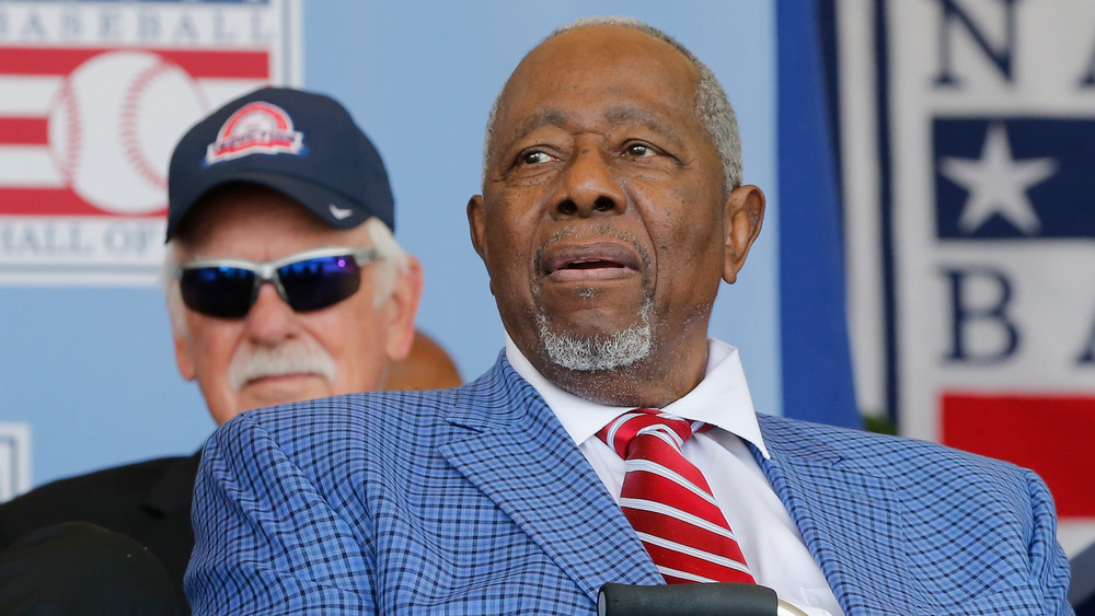 Hank Aaron wearing blue suit