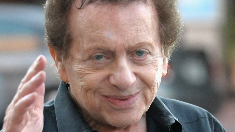 Jackie Mason waves