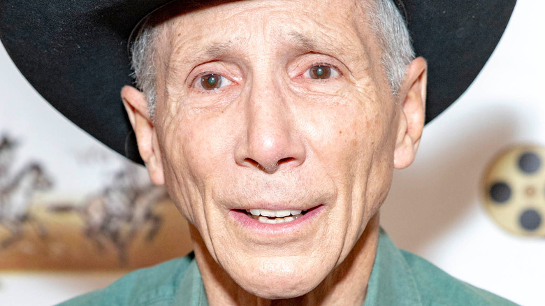 Johnny Crawford smiling in black cowboy hat