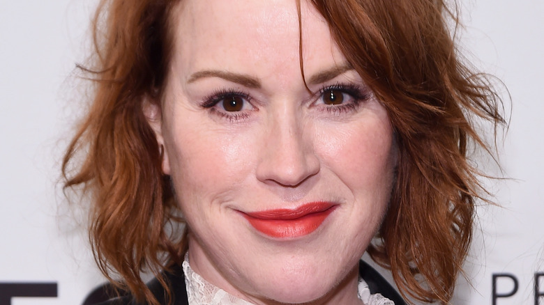 Molly Ringwald poses on the red carpet