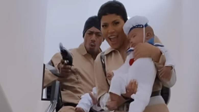 Nick Cannon, Abby De La Rosa, and their sons posing 