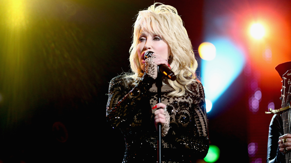 Dolly Parton performs in black top