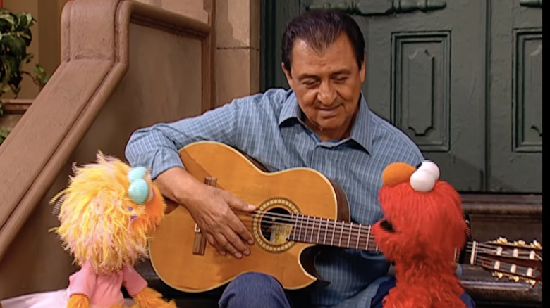 Emilio Delgado on sesame street with elmo
