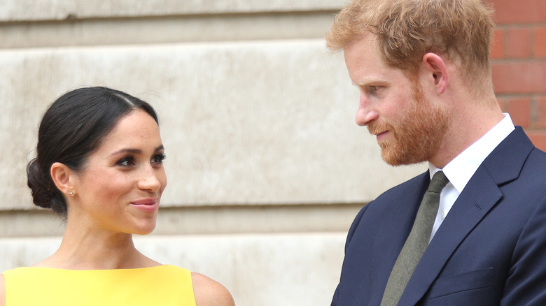 Meghan Markle smiling at Prince Harry