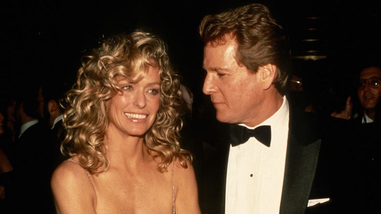 Ryan O'Neal gazing at Farrah Fawcett