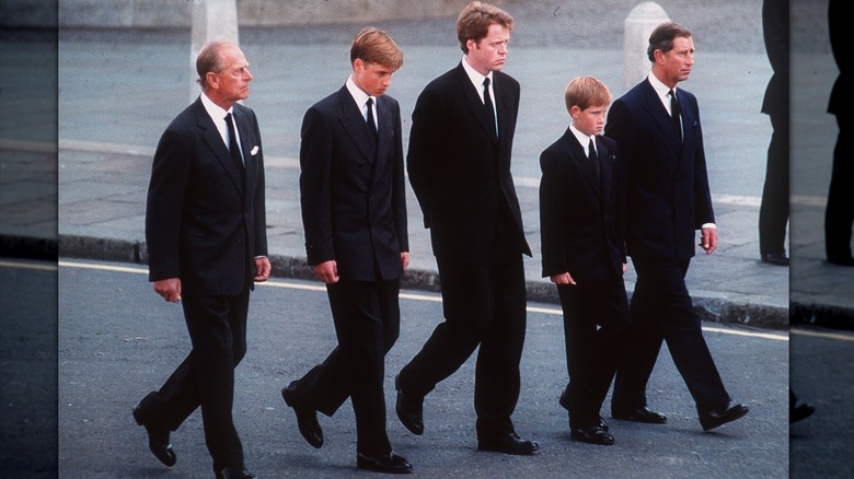 Prince Philip, William, Prince of Wales, Charles Spencer, Prince Harry, and King Charles walking together during Princess Diana's funeral