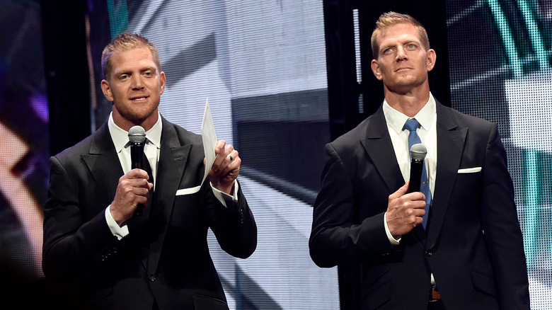 Benham brothers holding microphones