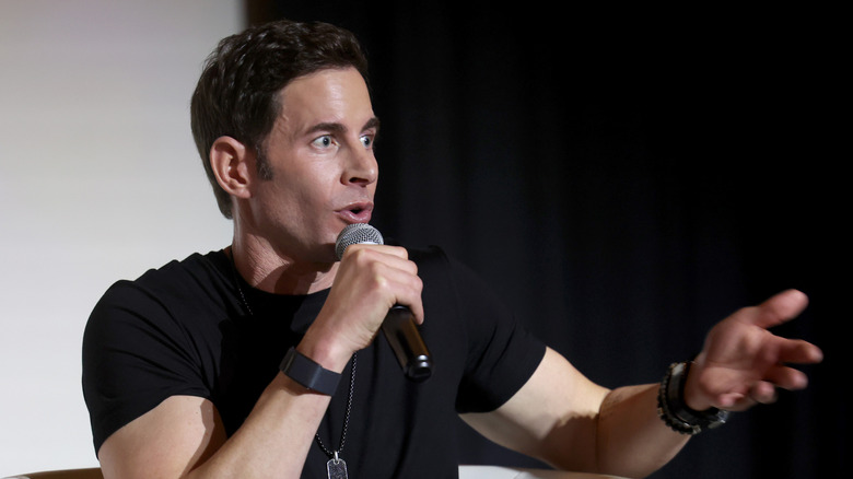 Tarek El Moussa speaking at an event