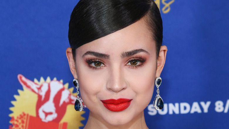 Sofia Carson posing on MTV Movie and TV Awards red carpet