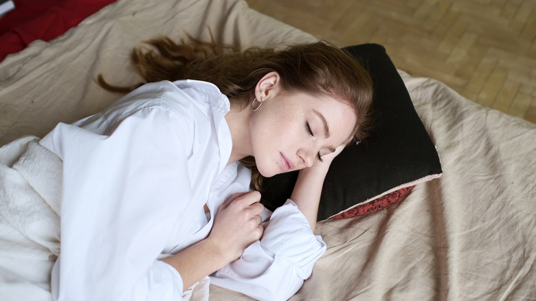 woman yawning with eyes closed