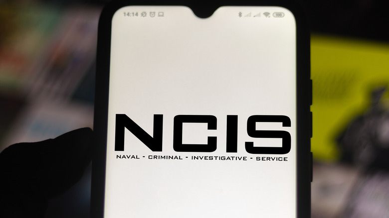 "NCIS" logo on phone screen