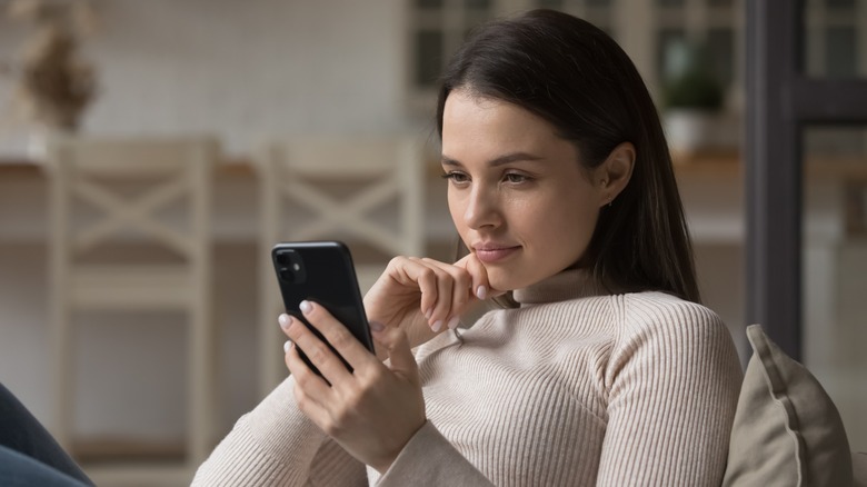 woman looking at phone