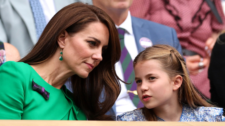 Kate Middleton and Princess Charlotte talking