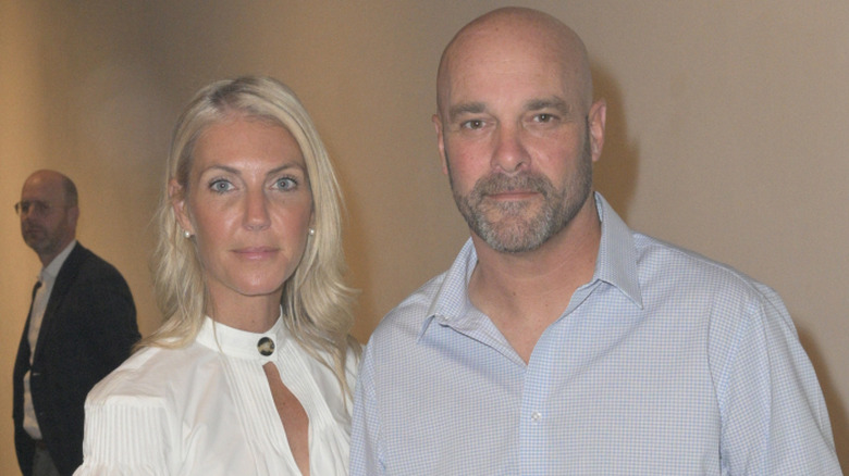Sarah Baeumler and Bryan Baeumler with a man standing in the background