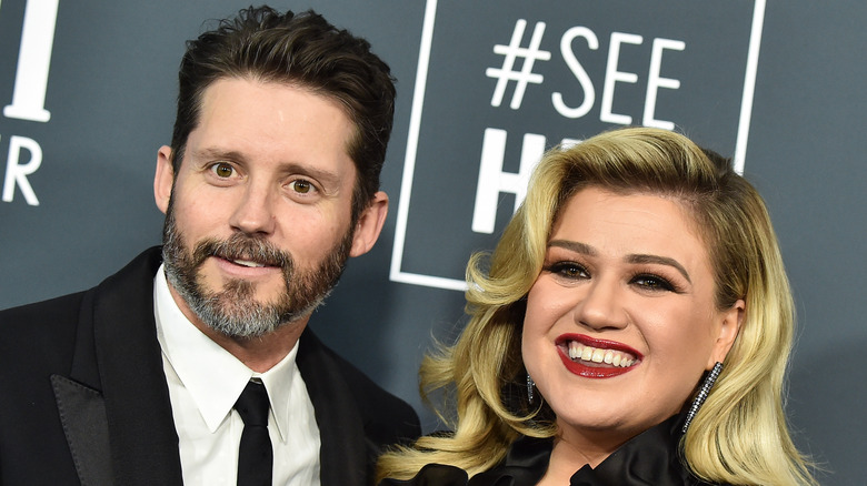 Kelly Clarkson and Brandon Blackstock on the red carpet 