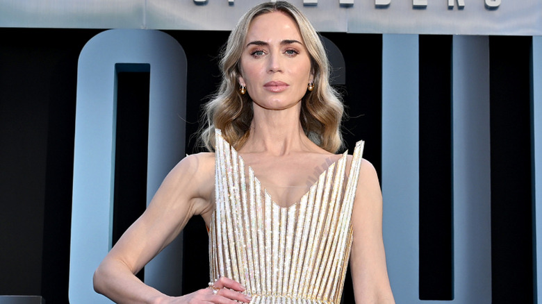 Emily Blunt posing with her hand on her hip