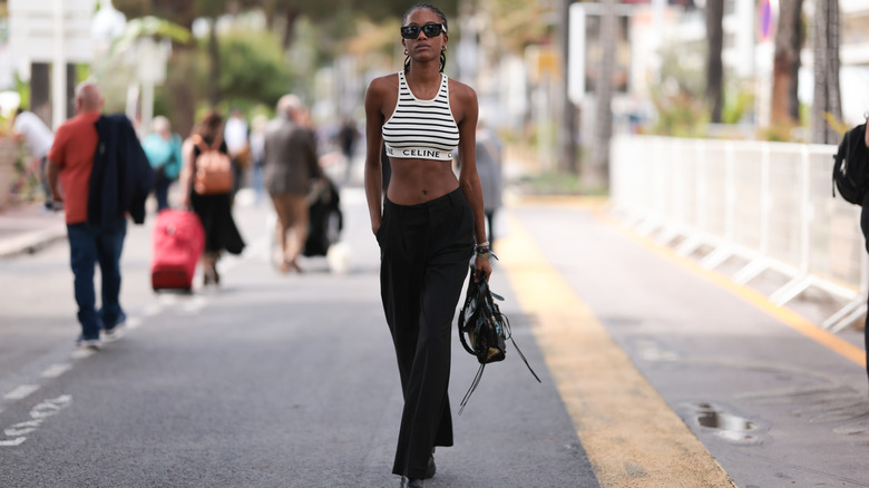 Woman wearing a crop top and wide-leg pants