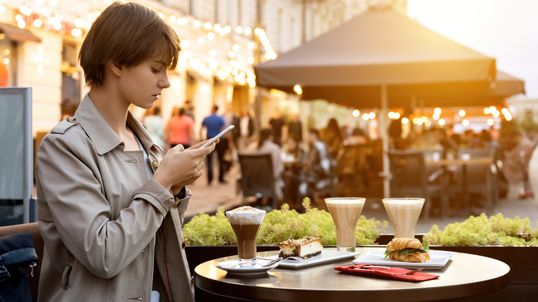 Person taking photo of food