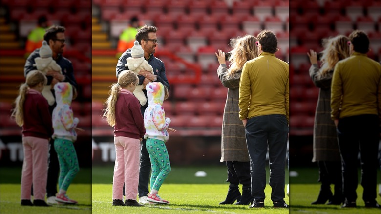 Blake Lively photographing Ryan Reynolds and baby