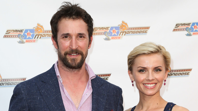 Noah Wyle and Sara Wells smiling in 2013