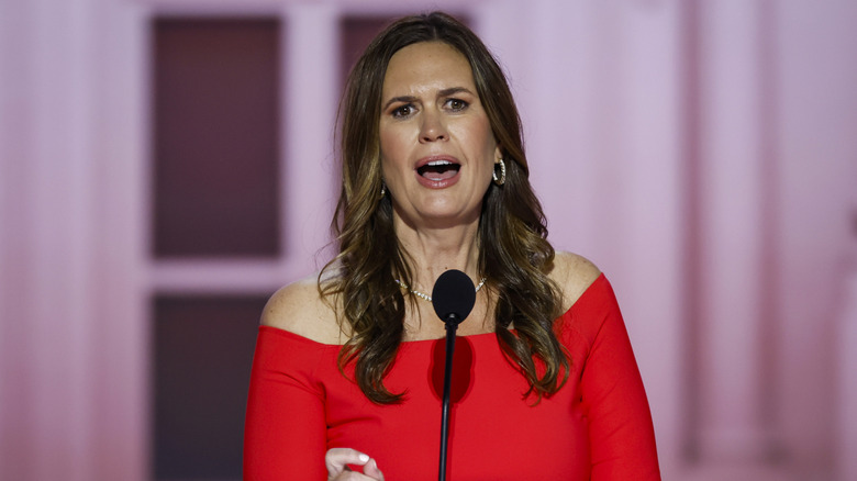 Sarah Huckabee Sanders speaking with microphone