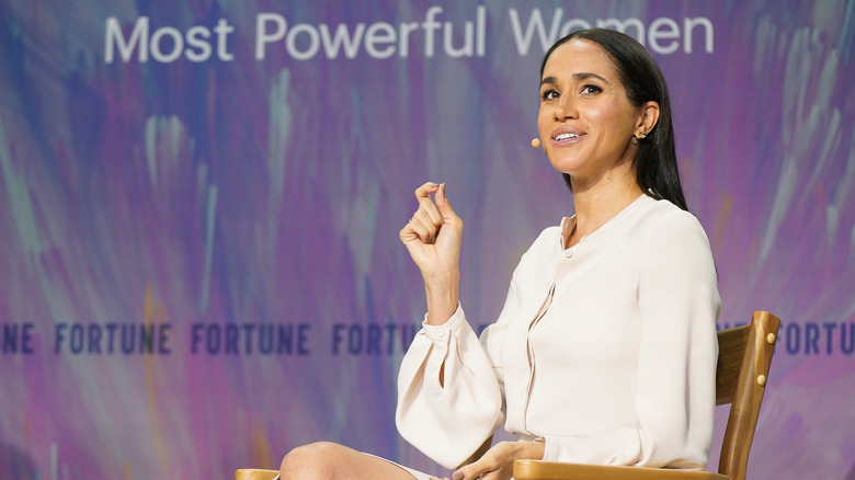 Meghan Markle sitting at the Most Powerful Women event