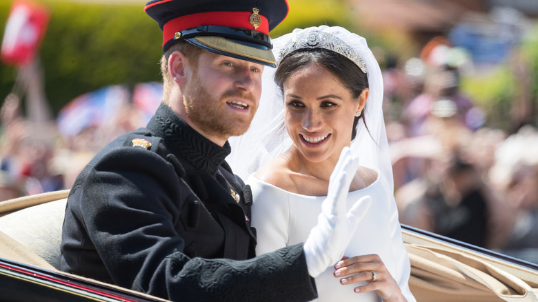 Prince Harry and Meghan Markle in a carriage on their wedding day