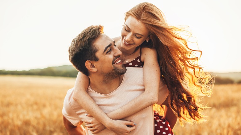 Happy couple smiling at one another