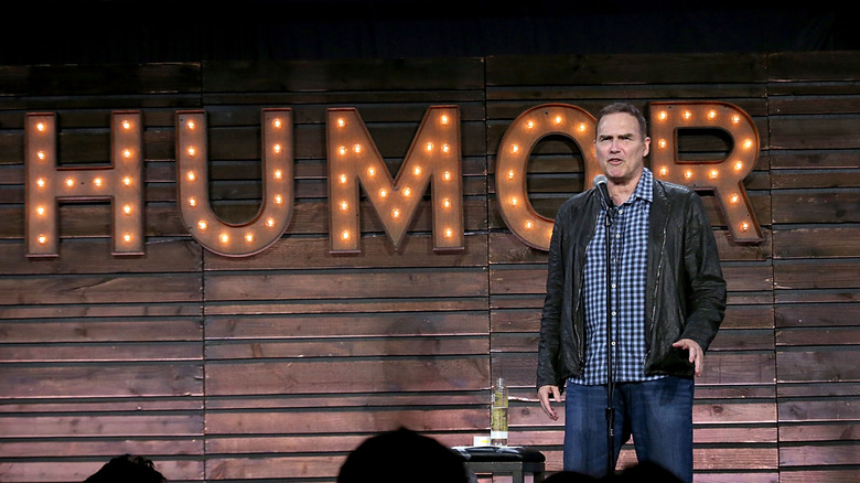Norm Macdonald performing Humor sign