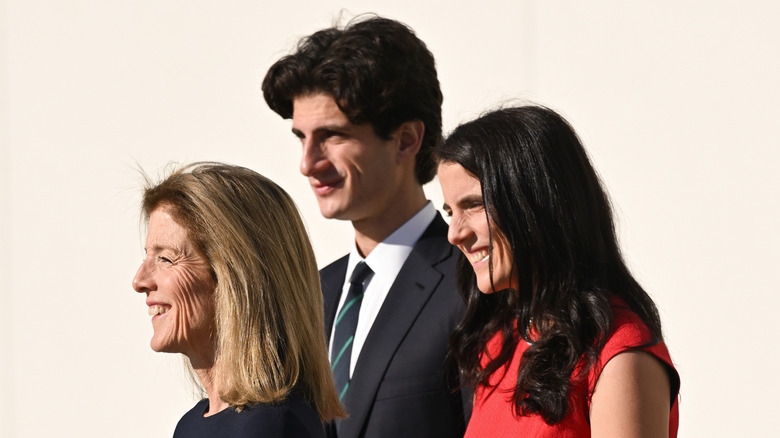 Caroline Kennedy, Jack Schlossberg, and Tatiana Schlossberg looking to the side and smiling