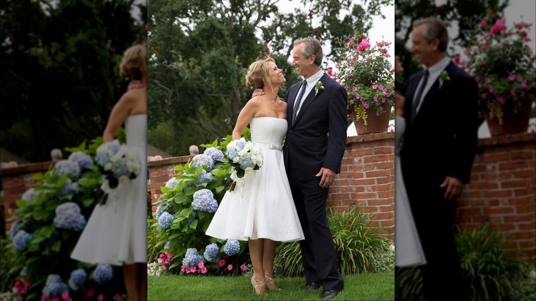 (l-r): Cheryl Hines and Robert F. Kennedy, Jr. smiling at each other on their wedding day