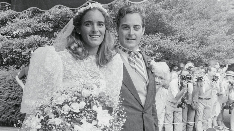 (l-r): Sydney Kennedy Lawford and her husband, James Peter McKelvy, smiling at their wedding.