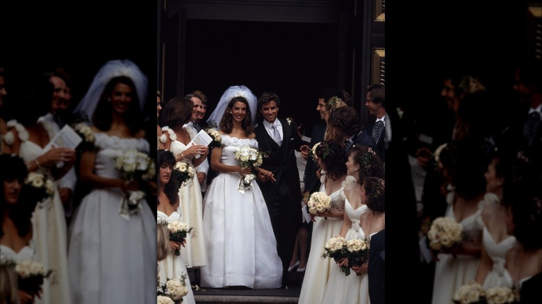 (l-r): Victoria Strauss and Maxwell "Max" Kennedy smiling and walking on their wedding day.