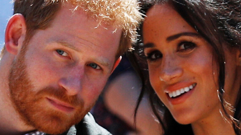 Prince Harry and Meghan Markle press their heads together