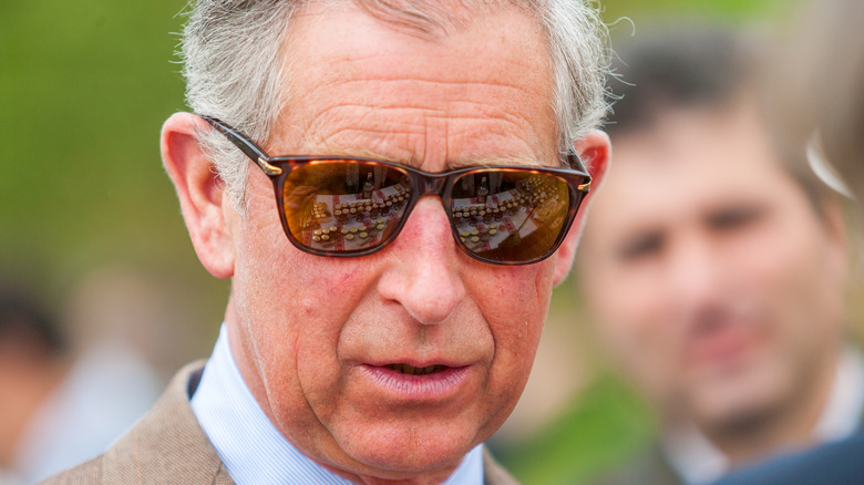 King Charles III wearing sunglasses