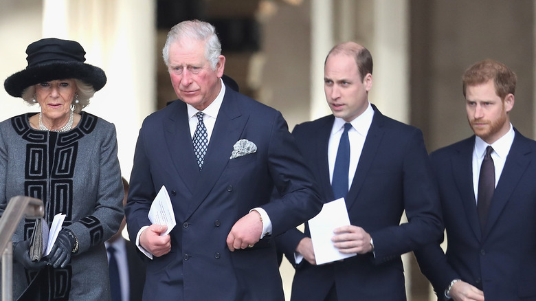 Prince Charles and wife Camilla standing with William and Harry