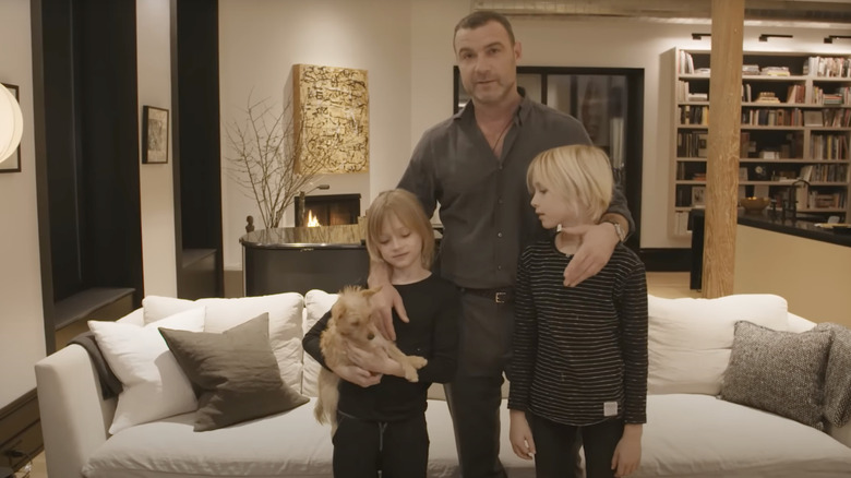 Kai Schreiber posing with Liev Schreiber and Sasha Schreiber at home